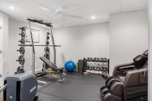 workout room with recessed lighting, a paneled ceiling, and a ceiling fan