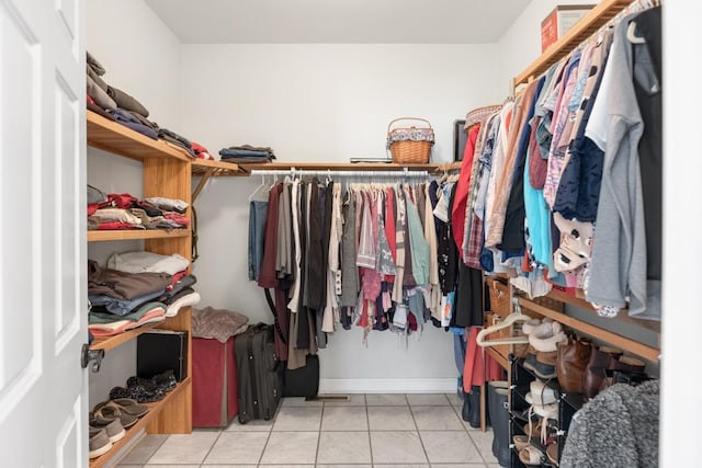 walk in closet featuring light tile patterned floors and visible vents