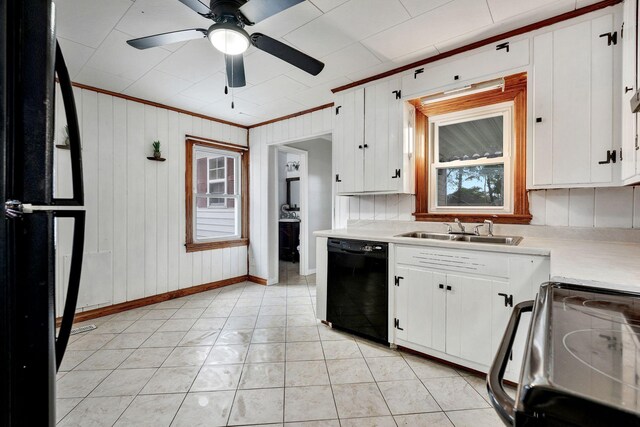 kitchen with white cabinets, light countertops, a sink, dishwasher, and electric stove