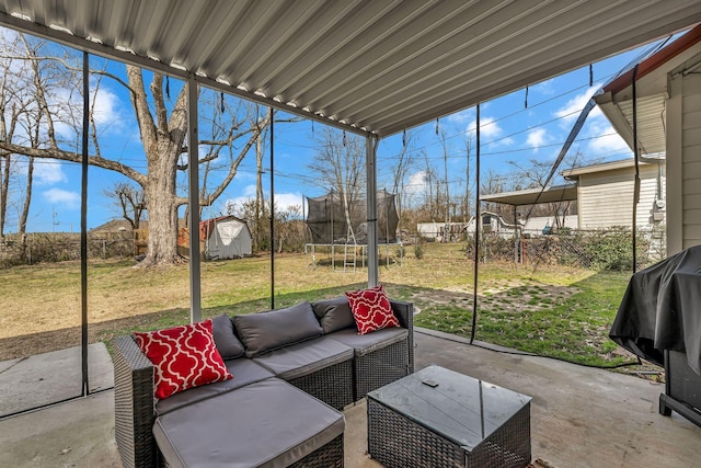 view of patio with a fenced backyard, an outdoor hangout area, a storage shed, an outbuilding, and a trampoline