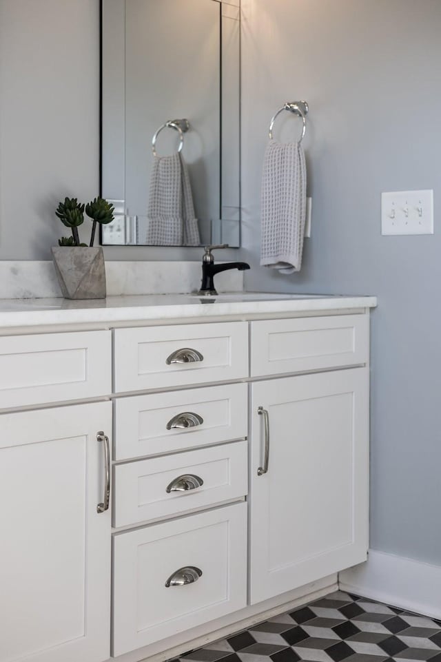 bathroom featuring tile patterned floors and vanity