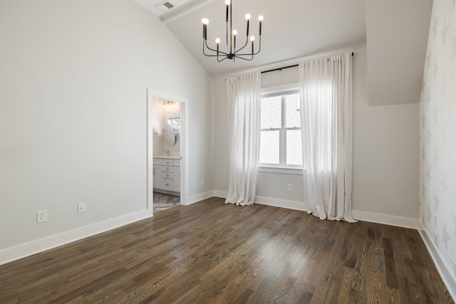 spare room with lofted ceiling, a notable chandelier, baseboards, and dark wood-style flooring