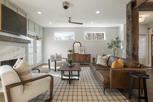 living room featuring recessed lighting, light wood-type flooring, and ceiling fan