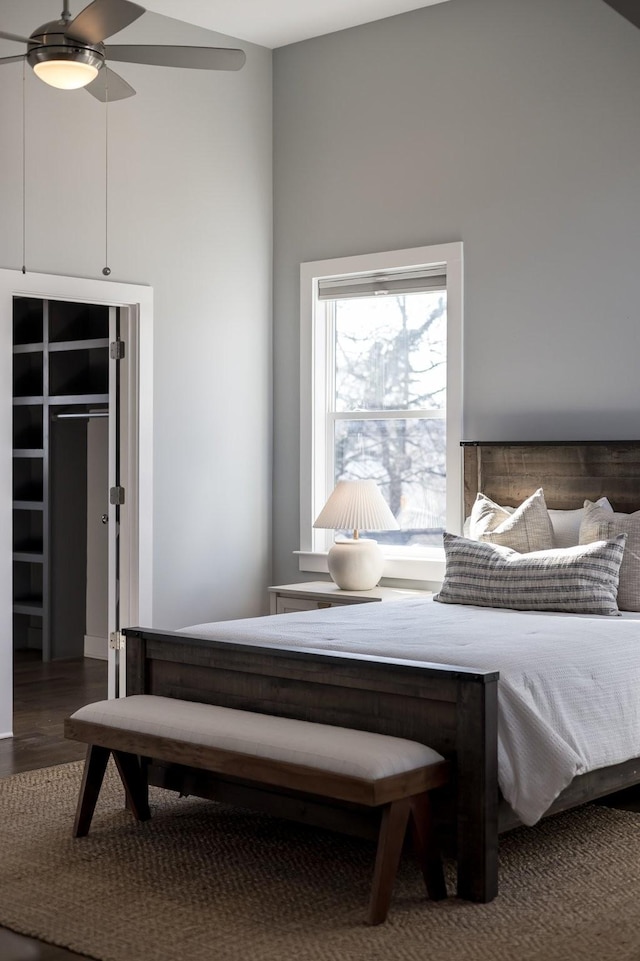 bedroom with ceiling fan and wood finished floors