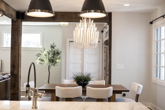 dining space with a chandelier and recessed lighting