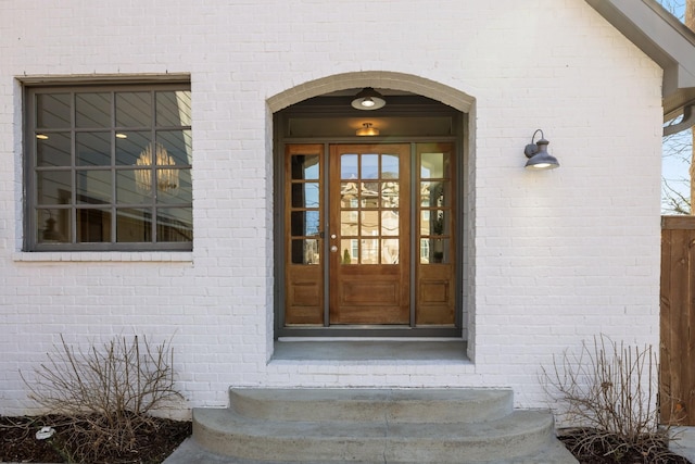 property entrance with brick siding