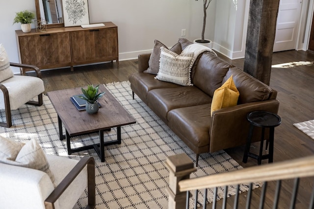 living area with wood finished floors and baseboards