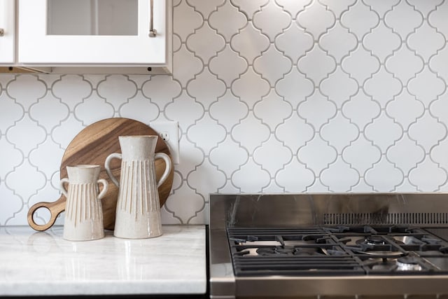 details with white cabinetry and range