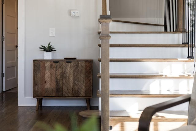 stairway featuring wood finished floors