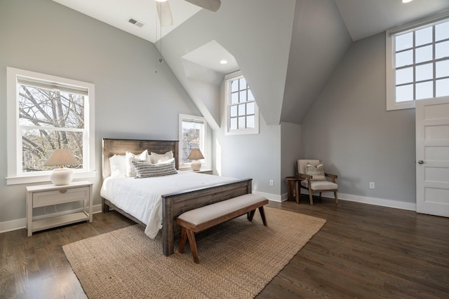 bedroom with dark wood-type flooring, baseboards, visible vents, and lofted ceiling