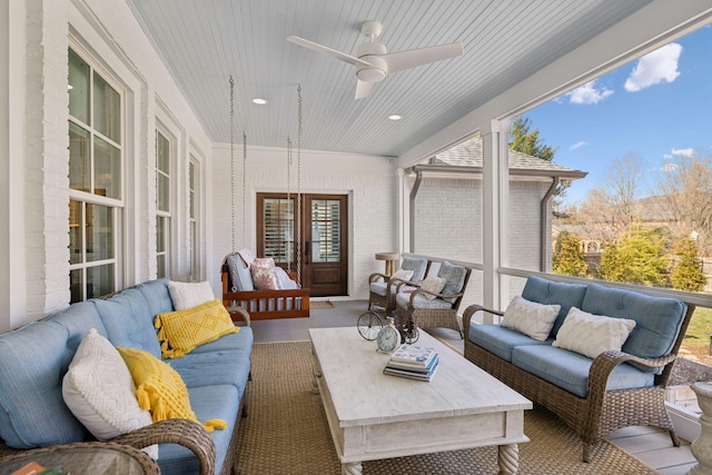 sunroom / solarium with wood ceiling and ceiling fan