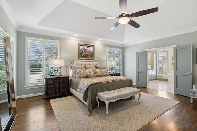 bedroom with crown molding, ceiling fan, baseboards, wood finished floors, and a raised ceiling