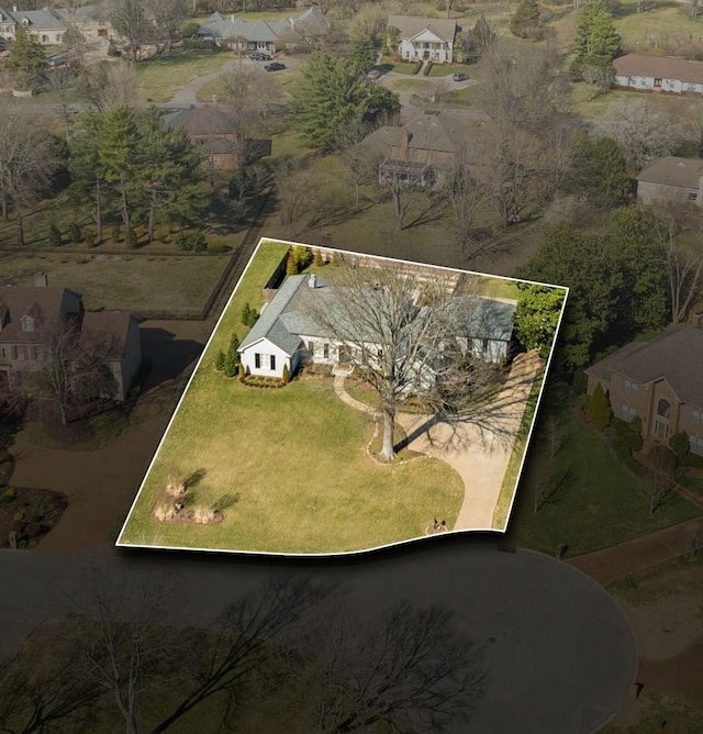 birds eye view of property with a residential view