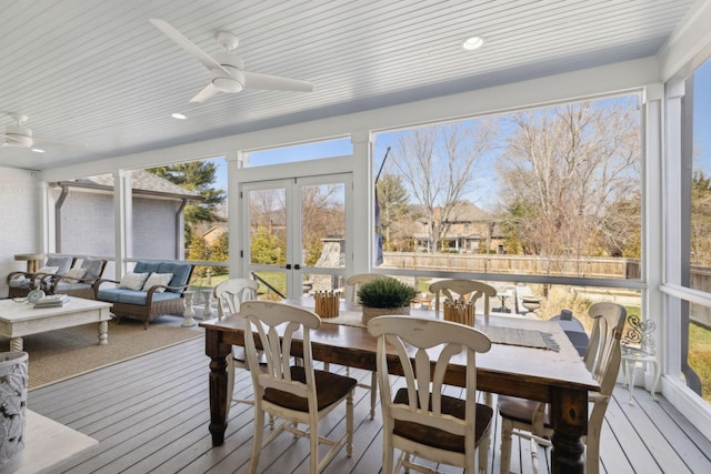 sunroom / solarium with a wealth of natural light, french doors, wooden ceiling, and a ceiling fan