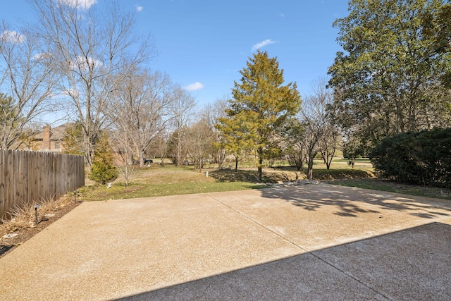 view of patio featuring fence