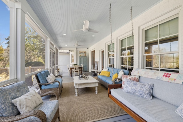 sunroom with ceiling fan