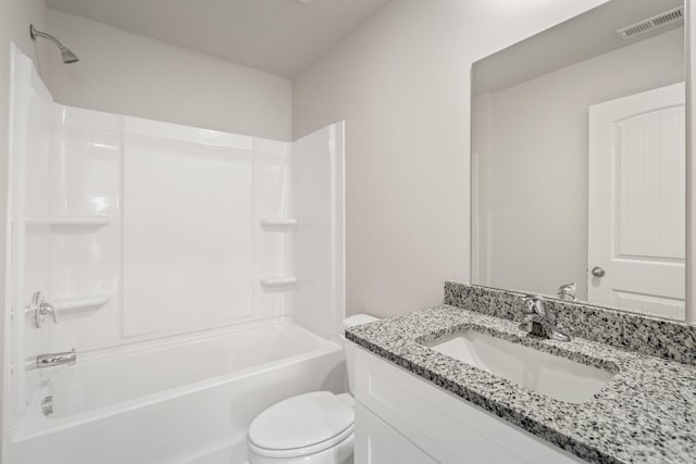 bathroom with vanity, toilet, visible vents, and shower / washtub combination