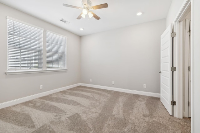 unfurnished bedroom with recessed lighting, carpet flooring, baseboards, and visible vents