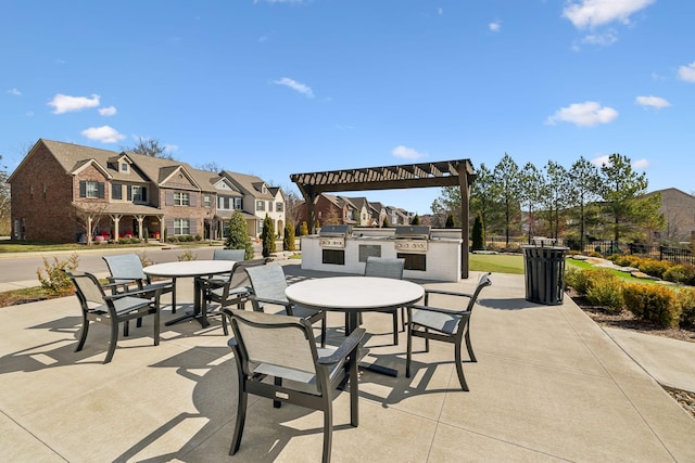 view of patio featuring outdoor dining space, area for grilling, a residential view, and grilling area