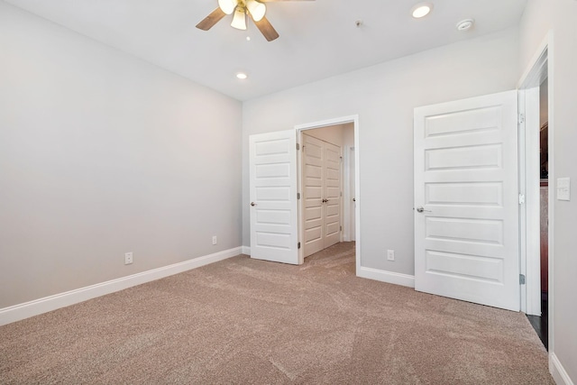 unfurnished bedroom featuring recessed lighting, baseboards, a ceiling fan, and carpet flooring