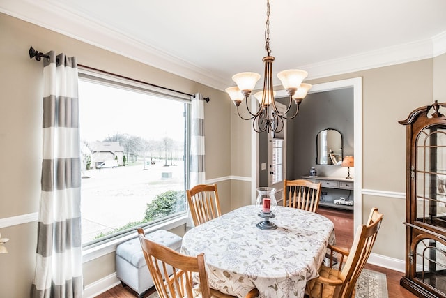 1013 Five Coves Trce, Gallatin, TN 37066 - dining room featuring crown molding, a notable chandelier, baseboards, and dark wood-style flooring