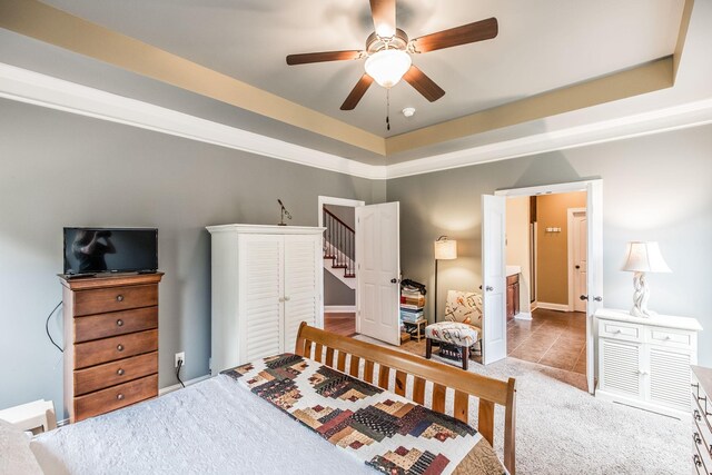 1013 Five Coves Trce, Gallatin, TN 37066 - carpeted bedroom featuring a tray ceiling and ceiling fan
