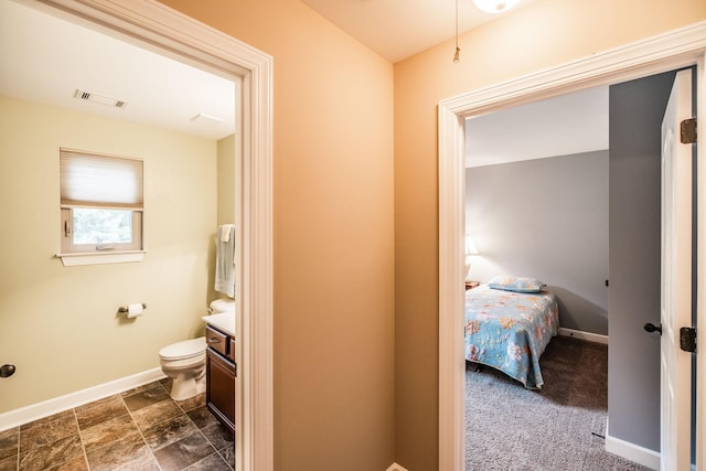 1013 Five Coves Trce, Gallatin, TN 37066 - bathroom featuring visible vents, baseboards, toilet, and vanity
