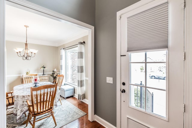 1013 Five Coves Trce, Gallatin, TN 37066 - dining room with a notable chandelier, wood finished floors, baseboards, and ornamental molding