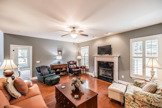 1013 Five Coves Trce, Gallatin, TN 37066 - living room with baseboards, a fireplace, wood finished floors, and a ceiling fan