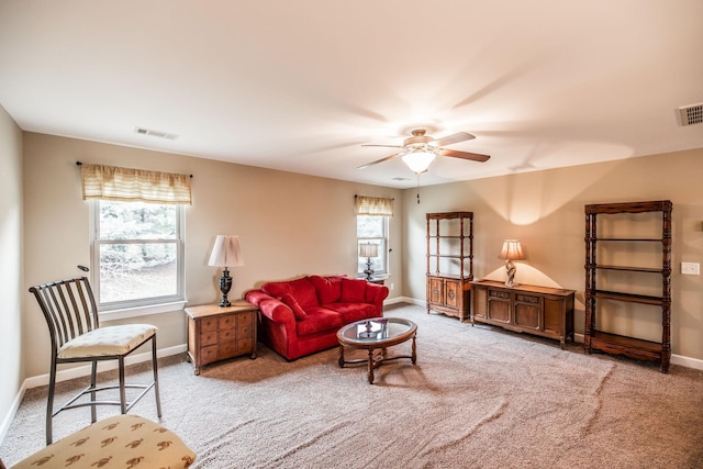 1013 Five Coves Trce, Gallatin, TN 37066 - carpeted living area featuring visible vents, baseboards, a healthy amount of sunlight, and a ceiling fan
