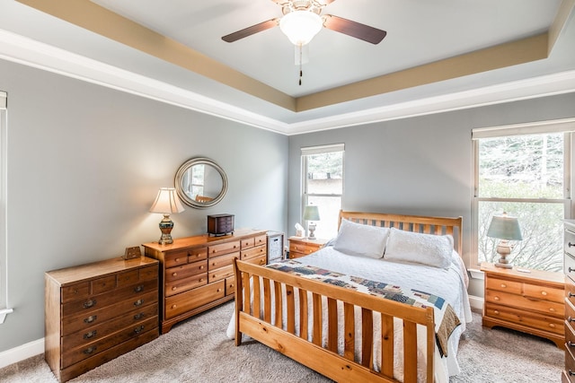 1013 Five Coves Trce, Gallatin, TN 37066 - bedroom featuring a ceiling fan, baseboards, ornamental molding, light carpet, and a raised ceiling