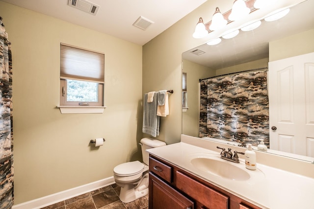 1013 Five Coves Trce, Gallatin, TN 37066 - full bath featuring visible vents, toilet, vanity, and baseboards