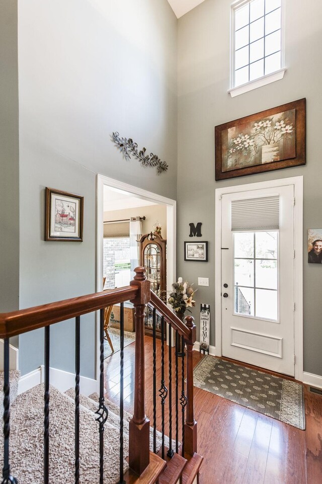 1013 Five Coves Trce, Gallatin, TN 37066 - entrance foyer with a healthy amount of sunlight, baseboards, a towering ceiling, and hardwood / wood-style flooring