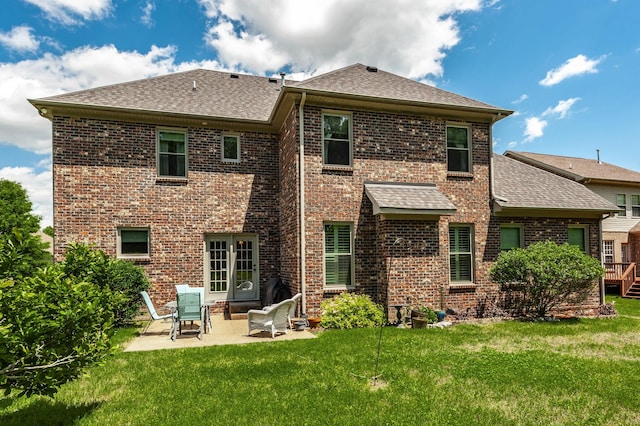 1013 Five Coves Trce, Gallatin, TN 37066 - back of house featuring a yard, a patio, brick siding, and a shingled roof