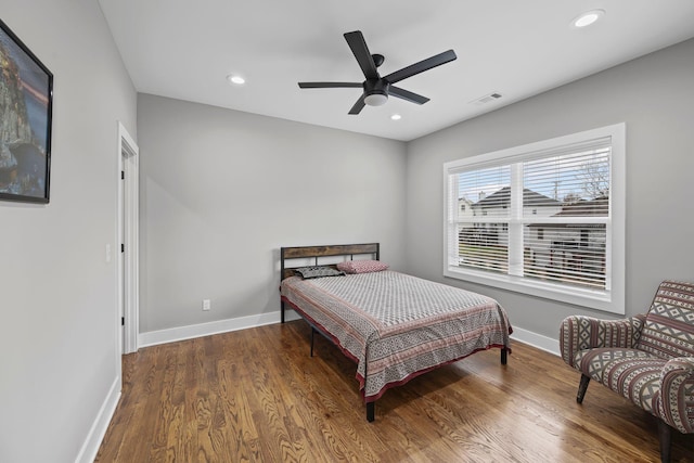 bedroom with wood finished floors, visible vents, baseboards, recessed lighting, and ceiling fan