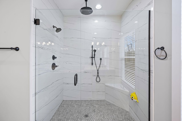 bathroom with a marble finish shower