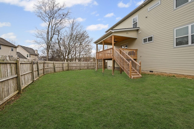 view of yard featuring a wooden deck, stairs, a fenced backyard, and a ceiling fan