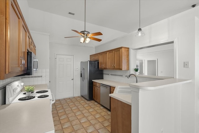 kitchen with a ceiling fan, a sink, stainless steel appliances, light countertops, and brown cabinets