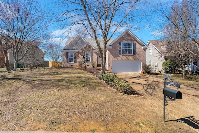 traditional-style house featuring a front lawn, brick siding, a garage, and driveway