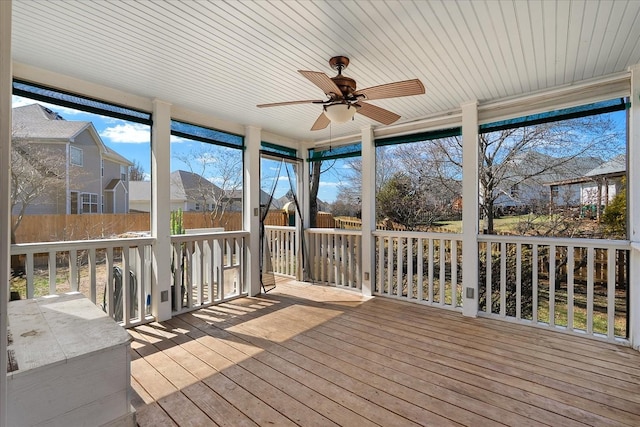 deck featuring a fenced backyard and a ceiling fan