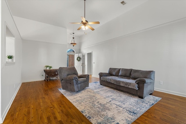 living area featuring visible vents, high vaulted ceiling, wood finished floors, baseboards, and ceiling fan