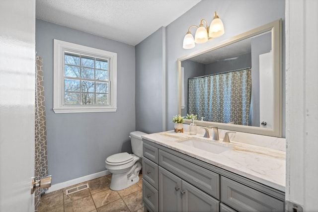 full bathroom with visible vents, baseboards, toilet, vanity, and a textured ceiling