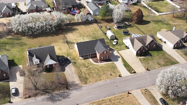 birds eye view of property with a residential view