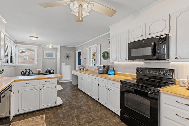 kitchen featuring a ceiling fan, a peninsula, ornamental molding, black appliances, and white cabinets