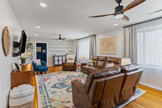 living room featuring recessed lighting, wood finished floors, baseboards, and ceiling fan