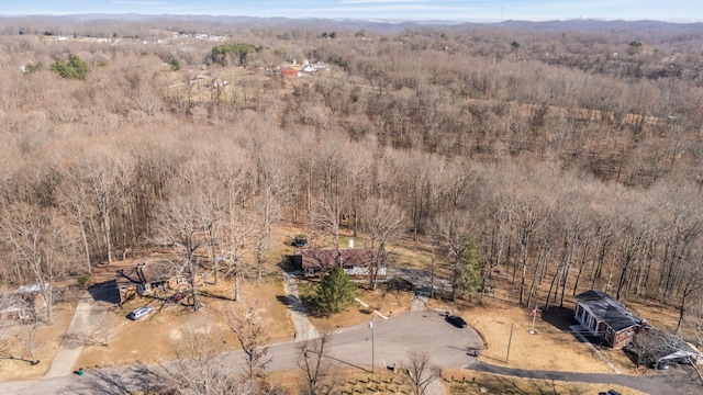 birds eye view of property with a wooded view