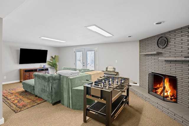 carpeted living room with baseboards and a fireplace