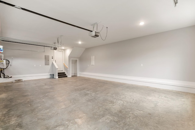 garage with electric panel and a garage door opener