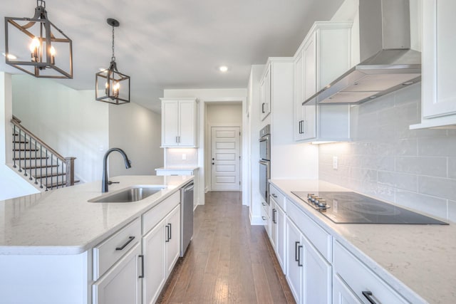 kitchen featuring black electric stovetop, a sink, white cabinets, dishwasher, and wall chimney range hood