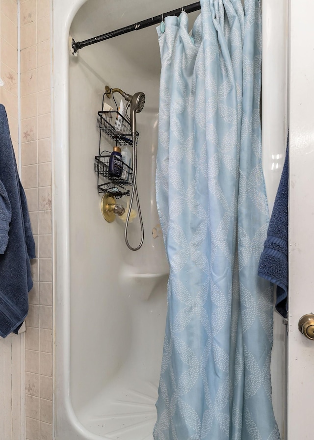 bathroom with a shower with shower curtain